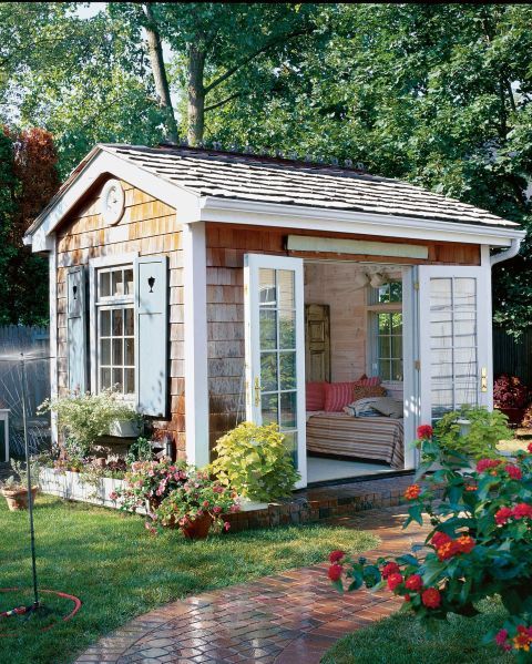 The Quaint Escape: With a cozy daybed and French doors that swing open to a charming and lush garden, this she-shed is the ultimate spot for whiling away a summer afternoon.